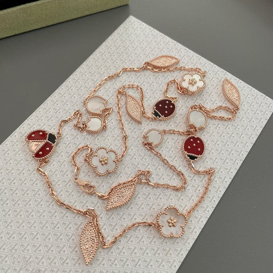 ˇGilded EraˇLUCKY SPRING 15 MOTIFS ROSE GOLD NECKLACE
